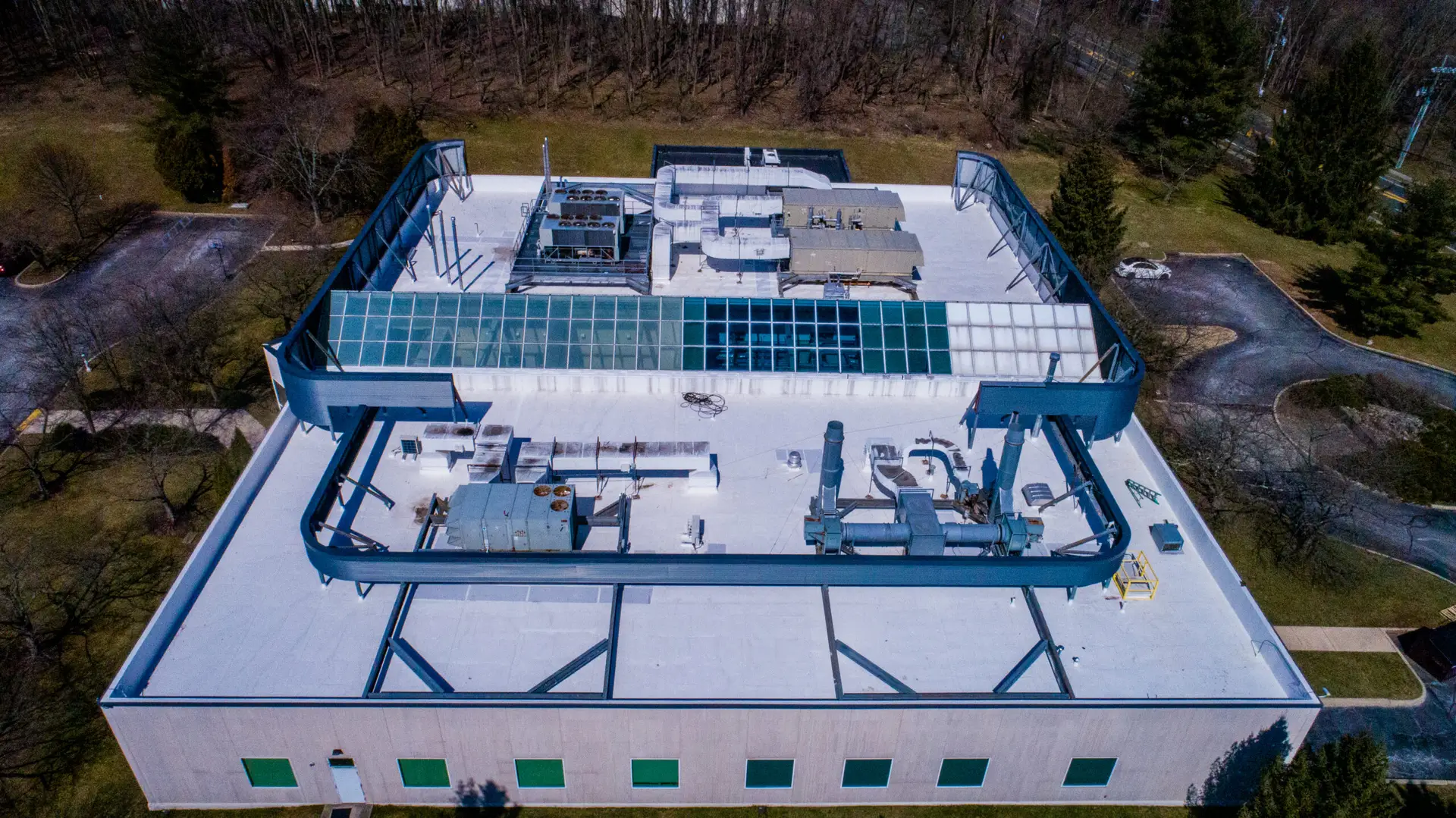 Completed commercial roofing project for cardiovascular research facility with flat roof membrane system