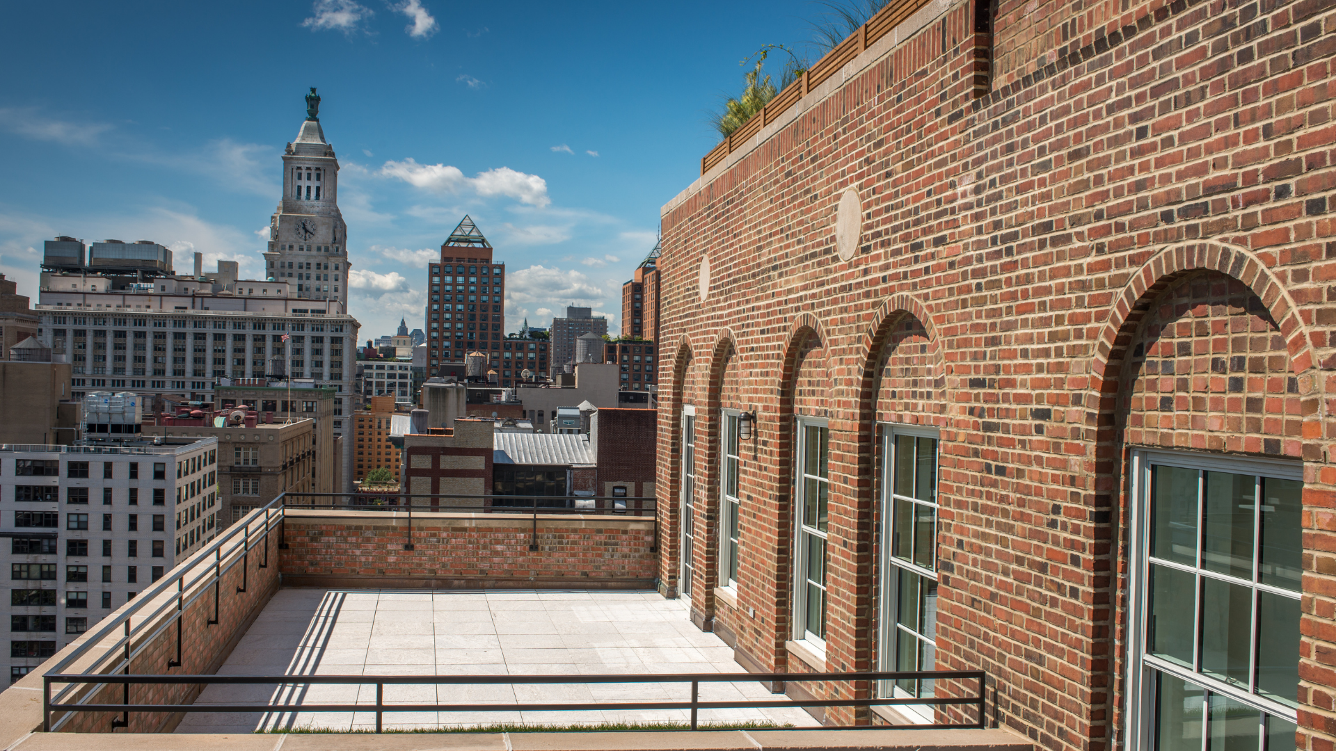 Commercial brick façade overlooking New York City skyline