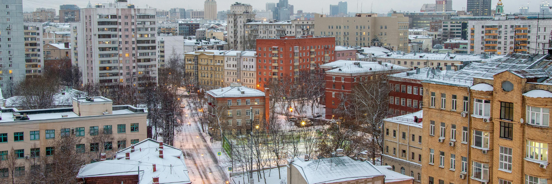 Snow-covered commercial buildings during winter in New York City