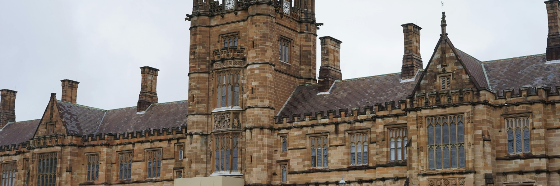 School building showing roofline, masonry walls, and façade details