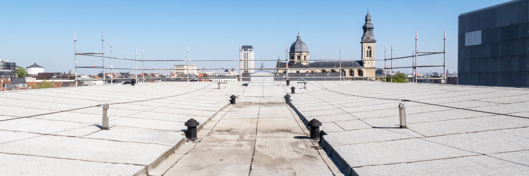 Exterior of a commercial building where roof system issues are not visible from ground level