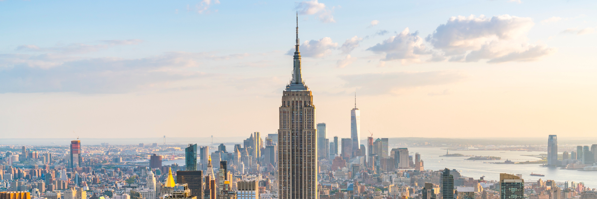 New York City skyline featuring commercial office buildings and the Empire State Building