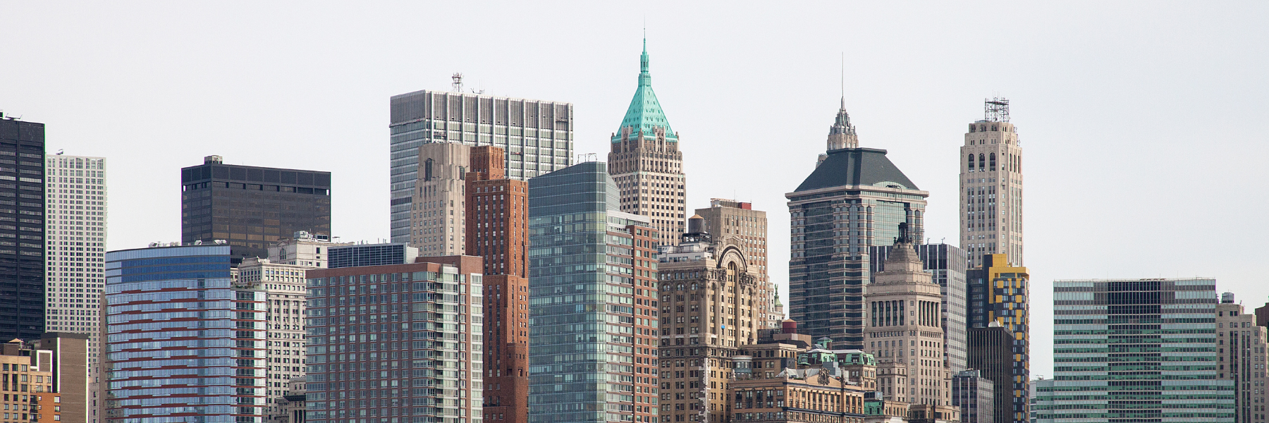 Aerial view of New York City buildings with flat commercial rooftops
